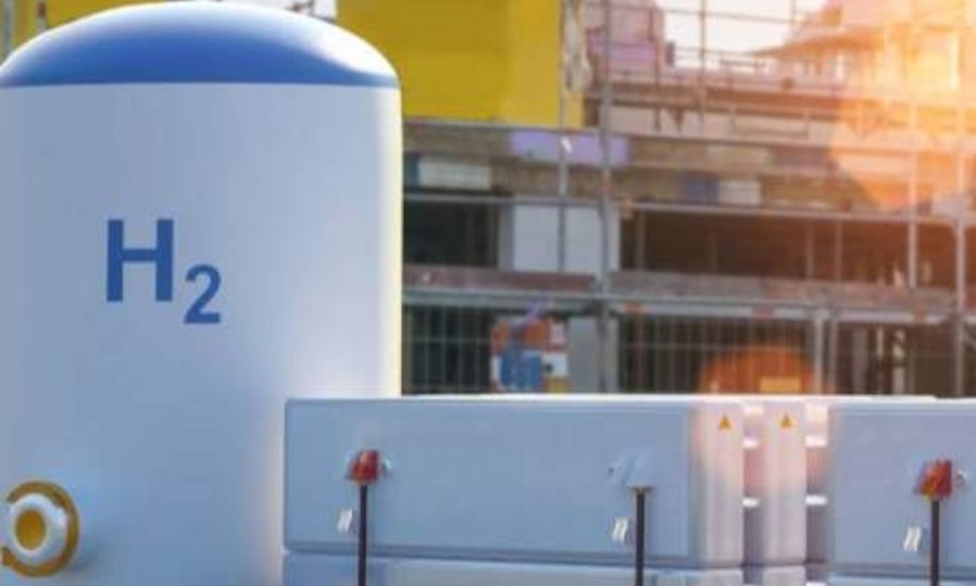 White hydrogen tank in front of a construction site